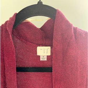 Contemporary maroon cardigan perfect to go with basic tops or dressed up!
